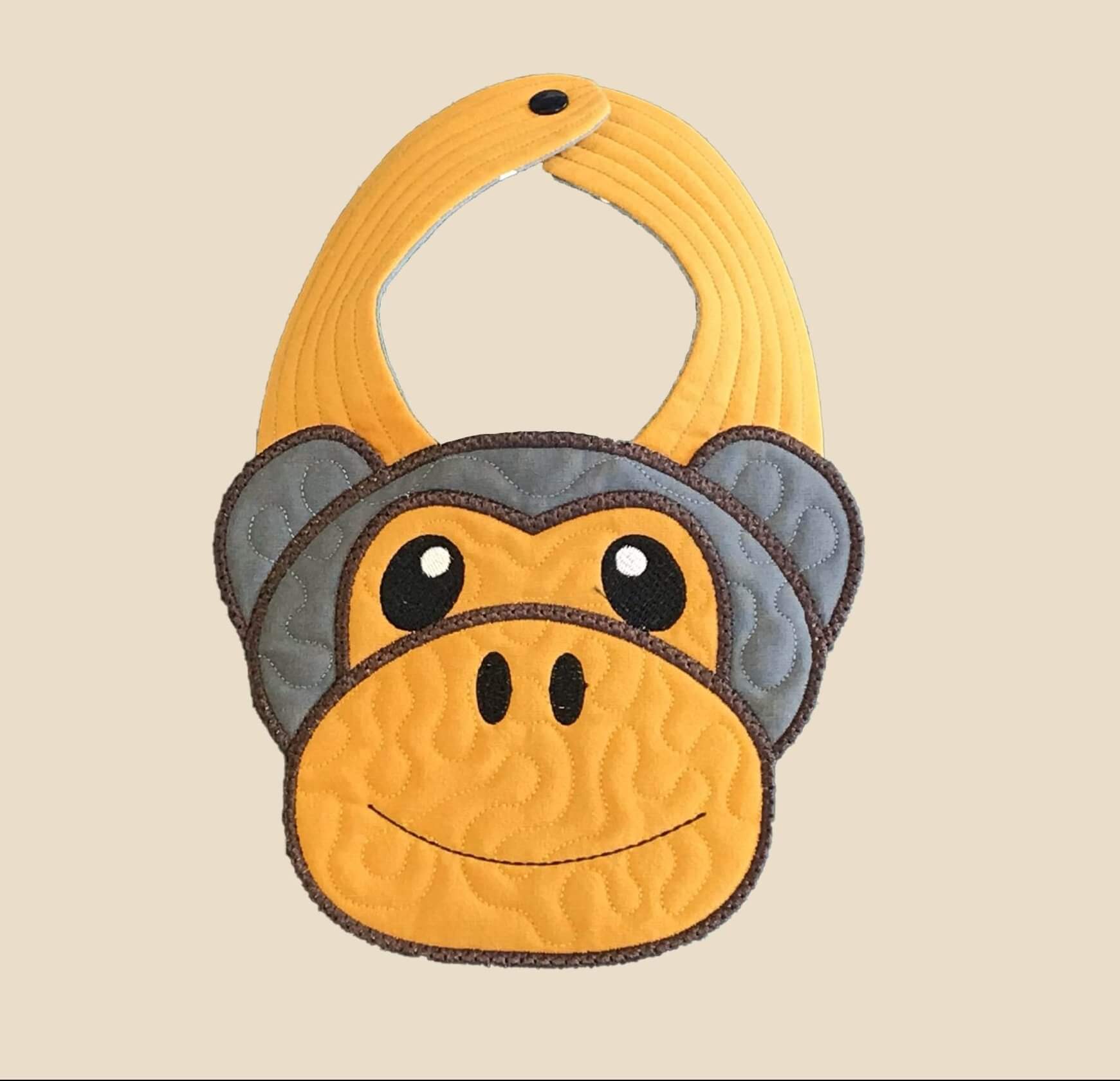 Bavoir tête de singe